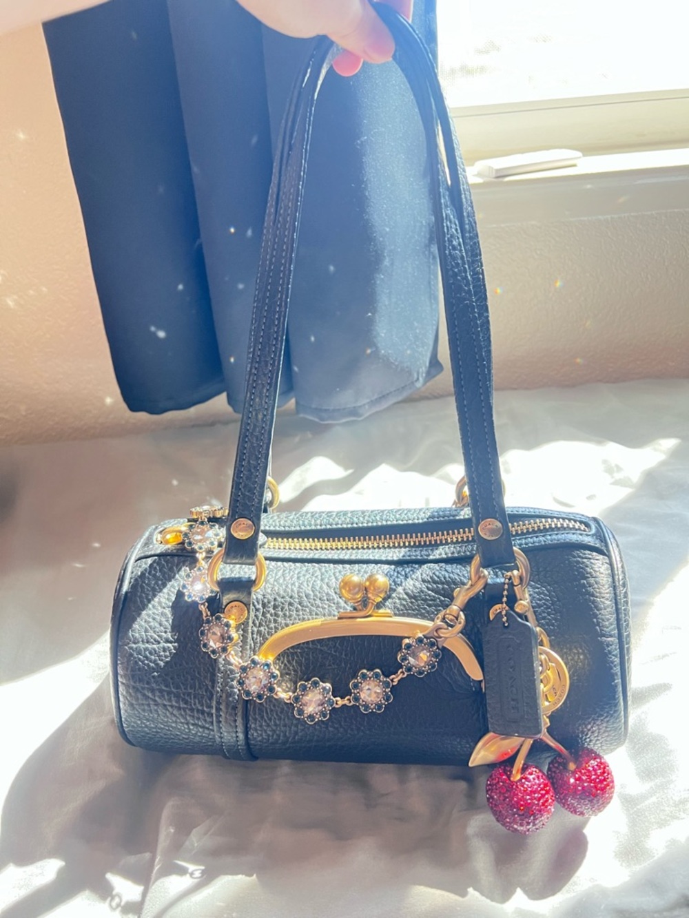 Coach Kisslock Barrel Bag in black pebbled leather